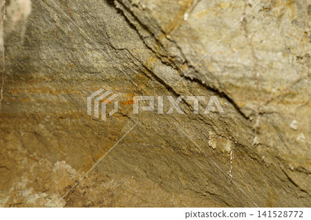 A wall where the geological layers are clearly visible A wall where the geological layers are clearly visible 141528772