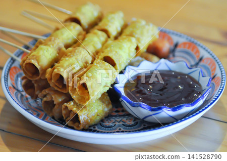 fried wonton, deep fried wonton or fried dumpling or deep fried dumpling and dip fried wonton, deep fried wonton or fried dumpling or deep fried dumpling and dip 141528790