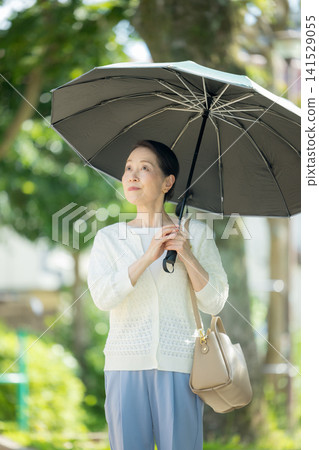 Senior woman sunblind Senior woman sunblind 141529055