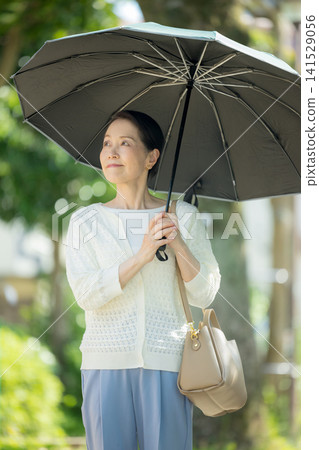 Senior woman sunblind Senior woman sunblind 141529056