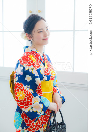 A woman in a yukata A woman in a yukata 141529070