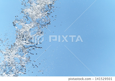 A vibrant summer sky with splashing water and a transparent, clear copy space for text. A vibrant summer sky with splashing water and a transparent, clear copy space for text. 141529501