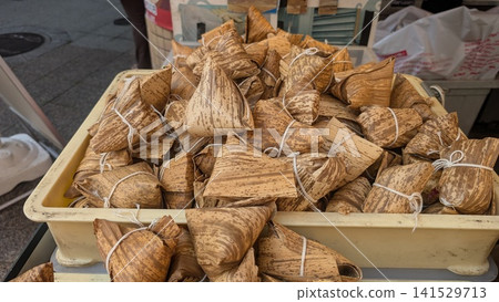 Chimaki wrapped in bamboo leaves, displayed in the shop Chimaki wrapped in bamboo leaves, displayed in the shop 141529713