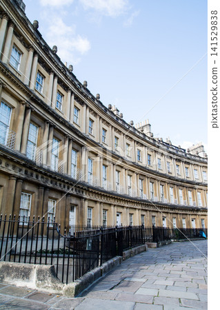 The Circus, a historic, curved, honey-colored stone building, is part of the cityscape of Bath, a UNESCO World Heritage Site in the UK. The Circus, a historic, curved, honey-colored stone building, is part of the cityscape of Bath, a UNESCO World Heritage Site in the UK. 141529838