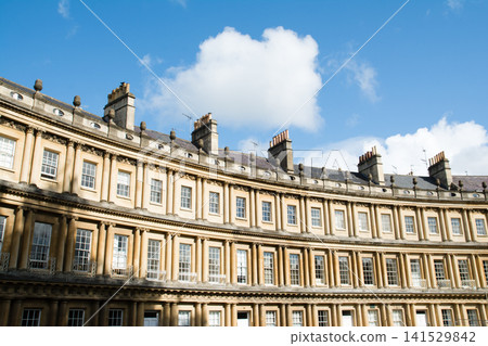 The Circus, a historic, curved, honey-colored stone building, is part of the cityscape of Bath, a UNESCO World Heritage Site in the UK. The Circus, a historic, curved, honey-colored stone building, is part of the cityscape of Bath, a UNESCO World Heritage Site in the UK. 141529842