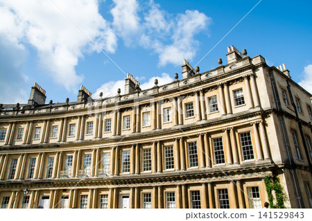 The Circus, a historic, curved, honey-colored stone building, is part of the cityscape of Bath, a UNESCO World Heritage Site in the UK. The Circus, a historic, curved, honey-colored stone building, is part of the cityscape of Bath, a UNESCO World Heritage Site in the UK. 141529843
