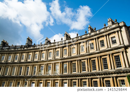 The Circus, a historic, curved, honey-colored stone building, is part of the cityscape of Bath, a UNESCO World Heritage Site in the UK. The Circus, a historic, curved, honey-colored stone building, is part of the cityscape of Bath, a UNESCO World Heritage Site in the UK. 141529844