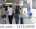 Traveler dragging a suitcase 141529995