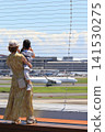 Parents and children looking at planes taking off Observation deck at Haneda Airport 141530275