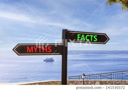 Facts or myths words symbol. Concept words Myths and Facts on beautiful black road sign. Beautiful blue sky background. Business and facts or myths concept. Copy space. Facts or myths words symbol. Concept words Myths and Facts on beautiful black road sign. Beautiful blue sky background. Business and facts or myths concept. Copy space. 141530372