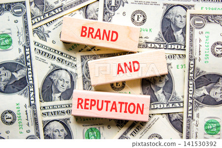Brand and reputation words symbol. Concept words Brand and reputation on beautiful wooden blocks. Beautiful dollar bills background. Dollar bills. Business brand and reputation concept. Copy space. Brand and reputation words symbol. Concept words Brand and reputation on beautiful wooden blocks. Beautiful dollar bills background. Dollar bills. Business brand and reputation concept. Copy space. 141530392