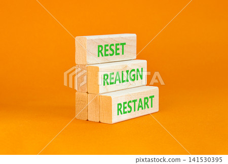 Reset realign restart words symbol. Concept words Reset realign restart on beautiful wooden blocks. Beautiful orange background. Business motivational and reset realign restart concept. Copy space. Reset realign restart words symbol. Concept words Reset realign restart on beautiful wooden blocks. Beautiful orange background. Business motivational and reset realign restart concept. Copy space. 141530395