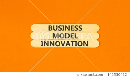 Business model innovation words symbol. Concept words Business model innovation on beautiful wooden sticks. Beautiful orange background. Business model innovation concept. Copy space. Business model innovation words symbol. Concept words Business model innovation on beautiful wooden sticks. Beautiful orange background. Business model innovation concept. Copy space. 141530412