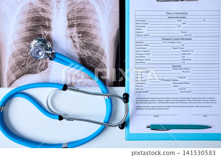 Treatment of lung diseases. Patient information form and stethoscope are on a doctor's table in medical clinic setting during daytime 141530583