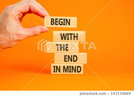 Begin with the end in mind symbol. Concept words Begin with the end in mind on beautiful wooden blocks. Beautiful orange paper background. Business begin with the end in mind concept. Copy space. Begin with the end in mind symbol. Concept words Begin with the end in mind on beautiful wooden blocks. Beautiful orange paper background. Business begin with the end in mind concept. Copy space. 141530669
