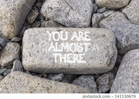 You are almost there symbol. Concept words You are almost there on beautiful grey stone. Beautiful grey stones background. Business You are almost there motivational support concept. Copy space You are almost there symbol. Concept words You are almost there on beautiful grey stone. Beautiful grey stones background. Business You are almost there motivational support concept. Copy space 141530679