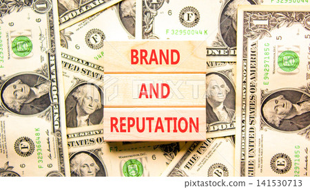 Brand and reputation words symbol. Concept words Brand and reputation on beautiful wooden blocks. Beautiful dollar bills background. Dollar bills. Business brand and reputation concept. Copy space. Brand and reputation words symbol. Concept words Brand and reputation on beautiful wooden blocks. Beautiful dollar bills background. Dollar bills. Business brand and reputation concept. Copy space. 141530713