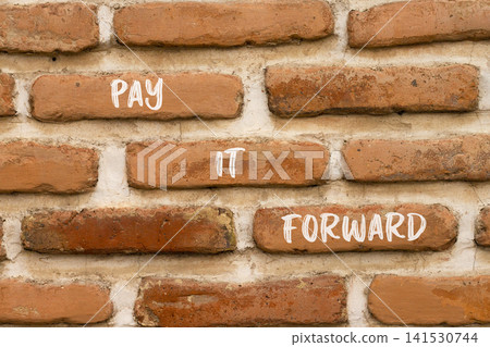 Pay it forward words symbol. Concept words Pay it forward on beautiful brick wall. Beautiful brick wall background. Business and pay it forward concept. Copy space. Pay it forward words symbol. Concept words Pay it forward on beautiful brick wall. Beautiful brick wall background. Business and pay it forward concept. Copy space. 141530744