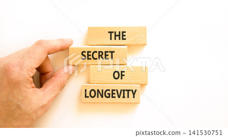 The secret of longevity words symbol. Concept words The secret of longevity on beautiful wooden blocks. Beautiful white background. Psychological medical the secret of longevity concept. Copy space. The secret of longevity words symbol. Concept words The secret of longevity on beautiful wooden blocks. Beautiful white background. Psychological medical the secret of longevity concept. Copy space. 141530751
