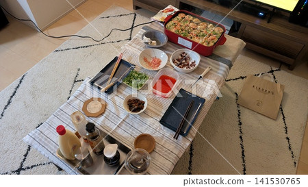A takoyaki party table enjoyed at home 141530765