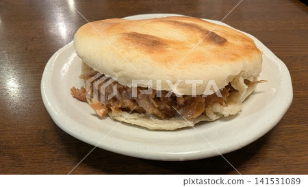 A plate of Chinese-style hamburger, Roujiamo. A plate of Chinese-style hamburger, Roujiamo. 141531089