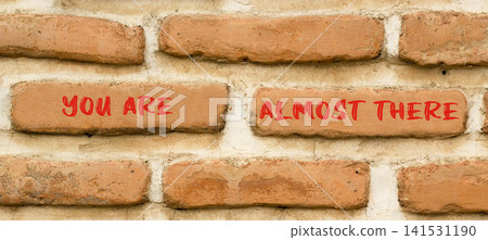 You are almost there words symbol. Concept words You are almost there on beautiful brick wall. Beautiful brick wall background. Business You are almost there motivational support concept. Copy space. You are almost there words symbol. Concept words You are almost there on beautiful brick wall. Beautiful brick wall background. Business You are almost there motivational support concept. Copy space. 141531190