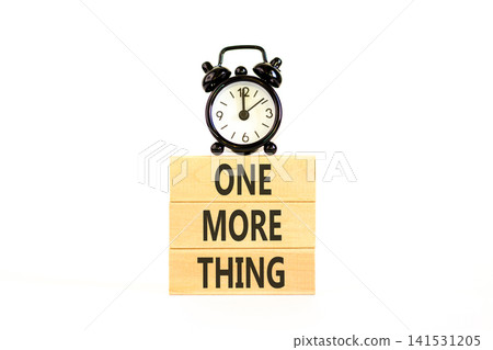 One more thing words symbol. Concept words One more thing on beautiful wooden blocks. Beautiful white background. Black alarm clock. Business and one more thing concept. Copy space. One more thing words symbol. Concept words One more thing on beautiful wooden blocks. Beautiful white background. Black alarm clock. Business and one more thing concept. Copy space. 141531205
