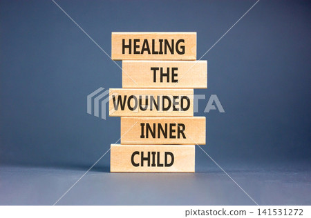 Healing the wounded inner child symbol. Concept words Healing the wounded inner child on beautiful wooden blocks. Beautiful grey background. Psychological Healing inner child concept. Copy space. Healing the wounded inner child symbol. Concept words Healing the wounded inner child on beautiful wooden blocks. Beautiful grey background. Psychological Healing inner child concept. Copy space. 141531272