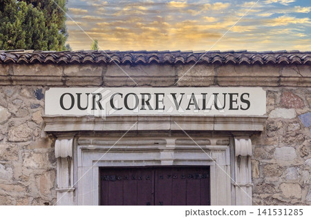 Our core values words symbol. Concept words Our core values on beautiful white sign plate. Beautiful stone wall background. Business our core values motivational support concept. Copy space. Our core values words symbol. Concept words Our core values on beautiful white sign plate. Beautiful stone wall background. Business our core values motivational support concept. Copy space. 141531285