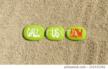 Call us now words symbol. Concept words Call us now on beautiful green stones. Beautiful sand background. Business support motivational and call us now concept. Copy space. Call us now words symbol. Concept words Call us now on beautiful green stones. Beautiful sand background. Business support motivational and call us now concept. Copy space. 141531302