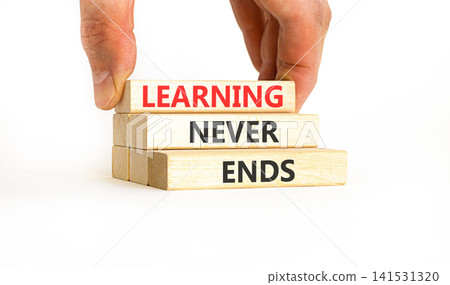 Learning never ends words symbol. Concept words Learning never ends on beautiful wooden blocks. Beautiful white background. Business support motivational and learning never ends concept. Copy space. Learning never ends words symbol. Concept words Learning never ends on beautiful wooden blocks. Beautiful white background. Business support motivational and learning never ends concept. Copy space. 141531320