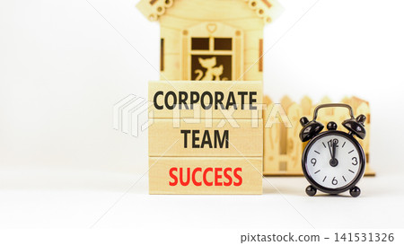 Corporate team success words symbol. Concept words Corporate team success on beautiful wooden blocks. Beautiful white background. Black alarm clock. Business corporate team success concept Copy space Corporate team success words symbol. Concept words Corporate team success on beautiful wooden blocks. Beautiful white background. Black alarm clock. Business corporate team success concept Copy space 141531326