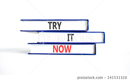 Try it now words symbol. Concept words Try is now on beautiful books. Beautiful white background. Business support motivational and try is now concept. Copy space. Try it now words symbol. Concept words Try is now on beautiful books. Beautiful white background. Business support motivational and try is now concept. Copy space. 141531328