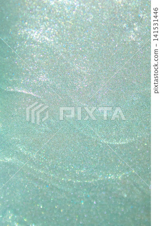 Mint green glitter texture with soft bokeh shimmer and sparkling abstract background Mint green glitter texture with soft bokeh shimmer and sparkling abstract background 141531446