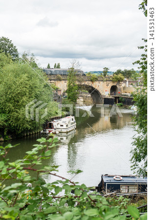 The historic stone and brick houses and bridges surrounded by trees – the cityscape of Bath, a UNESCO World Heritage Site in the UK. The historic stone and brick houses and bridges surrounded by trees – the cityscape of Bath, a UNESCO World Heritage Site in the UK. 141531463