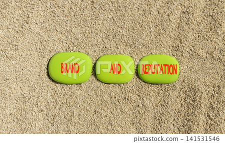 Brand and reputation words symbol. Concept words Brand and reputation on beautiful green stones. Beautiful sand background. Business brand and reputation concept. Copy space. Brand and reputation words symbol. Concept words Brand and reputation on beautiful green stones. Beautiful sand background. Business brand and reputation concept. Copy space. 141531546