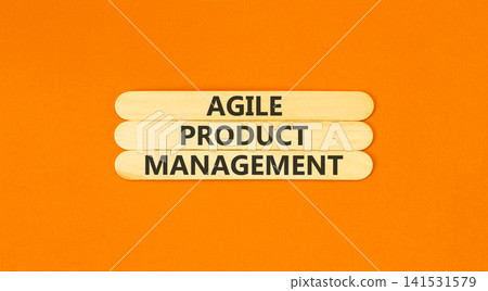 Agile product management words symbol. Concept words Agile product management on beautiful wooden sticks. Beautiful orange background. Business agile product management concept. Copy space. Agile product management words symbol. Concept words Agile product management on beautiful wooden sticks. Beautiful orange background. Business agile product management concept. Copy space. 141531579