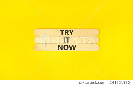 Try it now words symbol. Concept words Try is now on beautiful wooden sticks. Beautiful yellow background. Business support motivational and try is now concept. Copy space. Try it now words symbol. Concept words Try is now on beautiful wooden sticks. Beautiful yellow background. Business support motivational and try is now concept. Copy space. 141531580