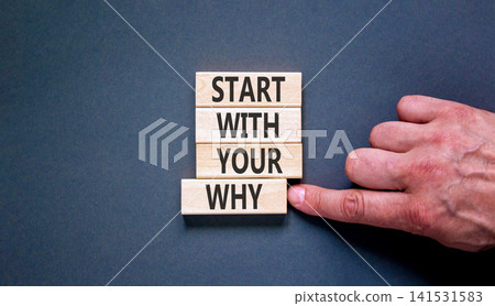 Start with your why words symbol. Concept words Start with your why on beautiful wooden blocks. Beautiful grey background. Businessman hand. Business start with your why concept. Copy space. Start with your why words symbol. Concept words Start with your why on beautiful wooden blocks. Beautiful grey background. Businessman hand. Business start with your why concept. Copy space. 141531583