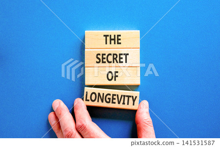 The secret of longevity words symbol. Concept words The secret of longevity on beautiful wooden blocks. Beautiful blue background. Psychological medical the secret of longevity concept. Copy space. The secret of longevity words symbol. Concept words The secret of longevity on beautiful wooden blocks. Beautiful blue background. Psychological medical the secret of longevity concept. Copy space. 141531587