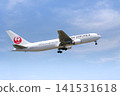 A Japan Airlines (JAL) Boeing 767 passenger plane taking off from Izumo Enmusubi Airport (with a blue sky background): Izumo City, Shimane Prefecture 141531618