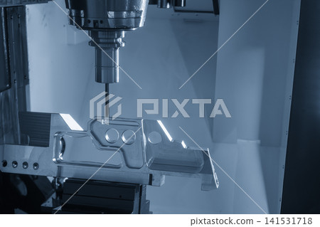High-precision 5-axis CNC milling machine cutting an aerospace part with a flat nose end mill tool. High-precision 5-axis CNC milling machine cutting an aerospace part with a flat nose end mill tool. 141531718