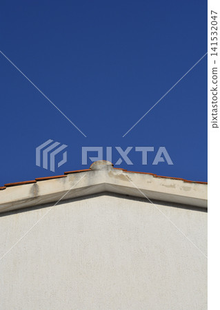 House Roof Gable Against Clear Blue Sky House Roof Gable Against Clear Blue Sky 141532047