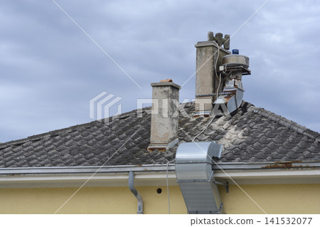 Old Roof Tiled Surface with Chimneys and Ventilation Outlet Old Roof Tiled Surface with Chimneys and Ventilation Outlet 141532077