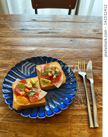 Open sandwich on a blue plate Open sandwich on a blue plate 141532412