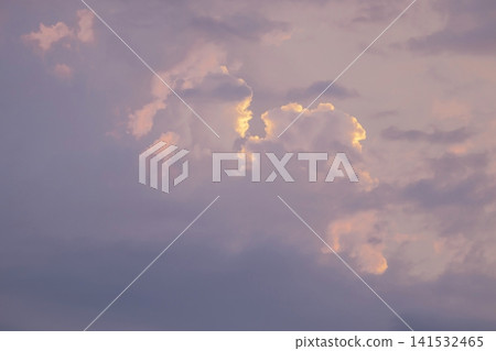 Soft pink and purple clouds at sunset. Fluffy cumulus clouds in the sky. Soft pink and purple clouds at sunset. Fluffy cumulus clouds in the sky. 141532465