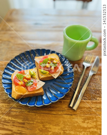 Open sandwich on a blue plate Open sandwich on a blue plate 141532513