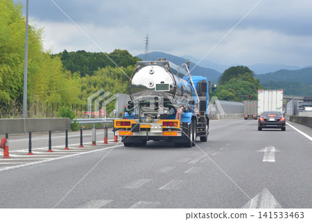 Tanker truck traveling on the highway Tanker truck traveling on the highway 141533463