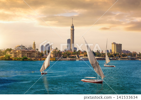 Stunning Sunset View of Cairo Tower and Feluccas on the Nile River Stunning Sunset View of Cairo Tower and Feluccas on the Nile River 141533634
