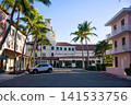 Quiet Street Lined With Palm Trees And Colonial Style Buildings 141533756